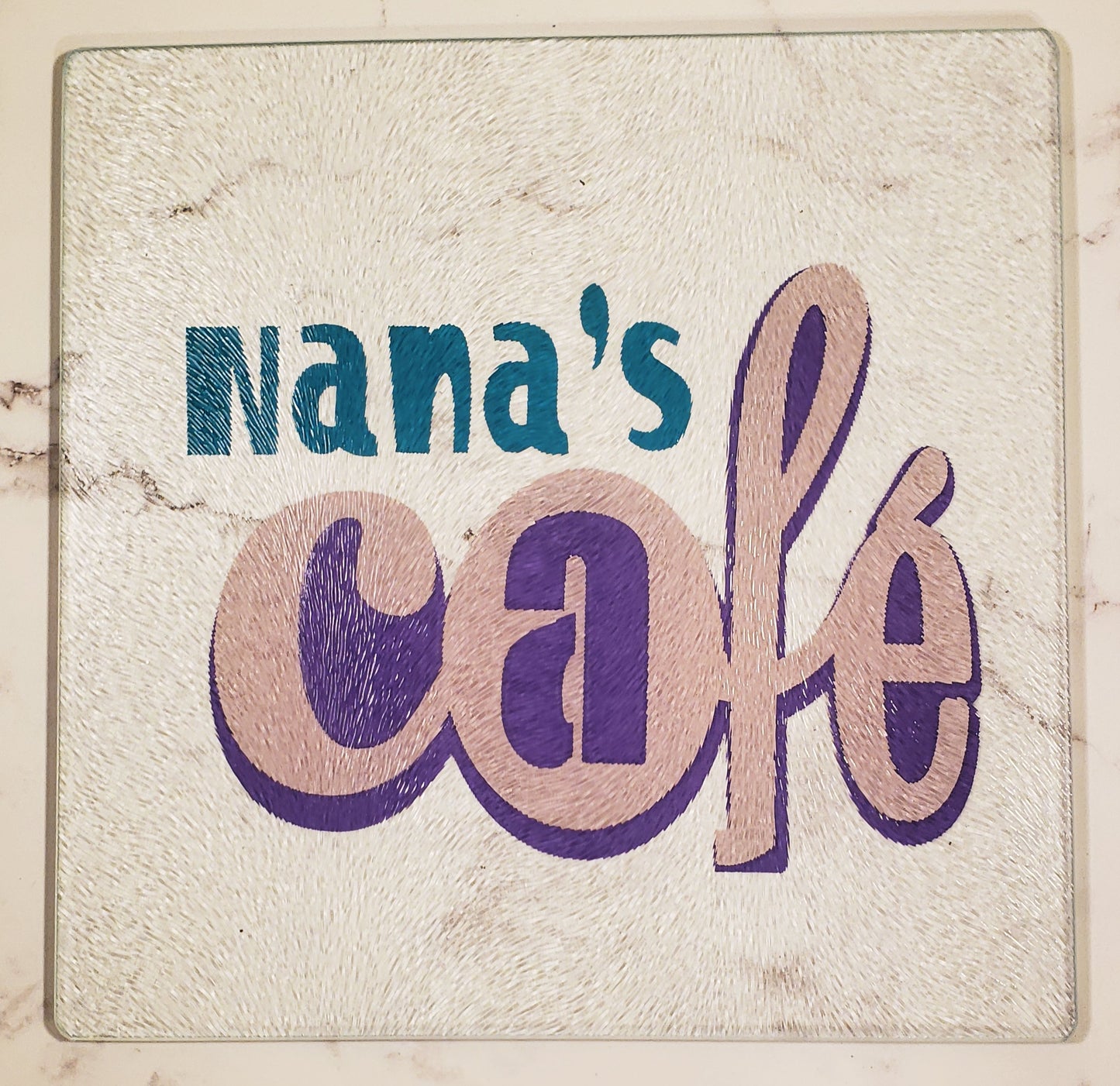 Nana's Café in Turquoise, Pink and Purple Glass Cutting board