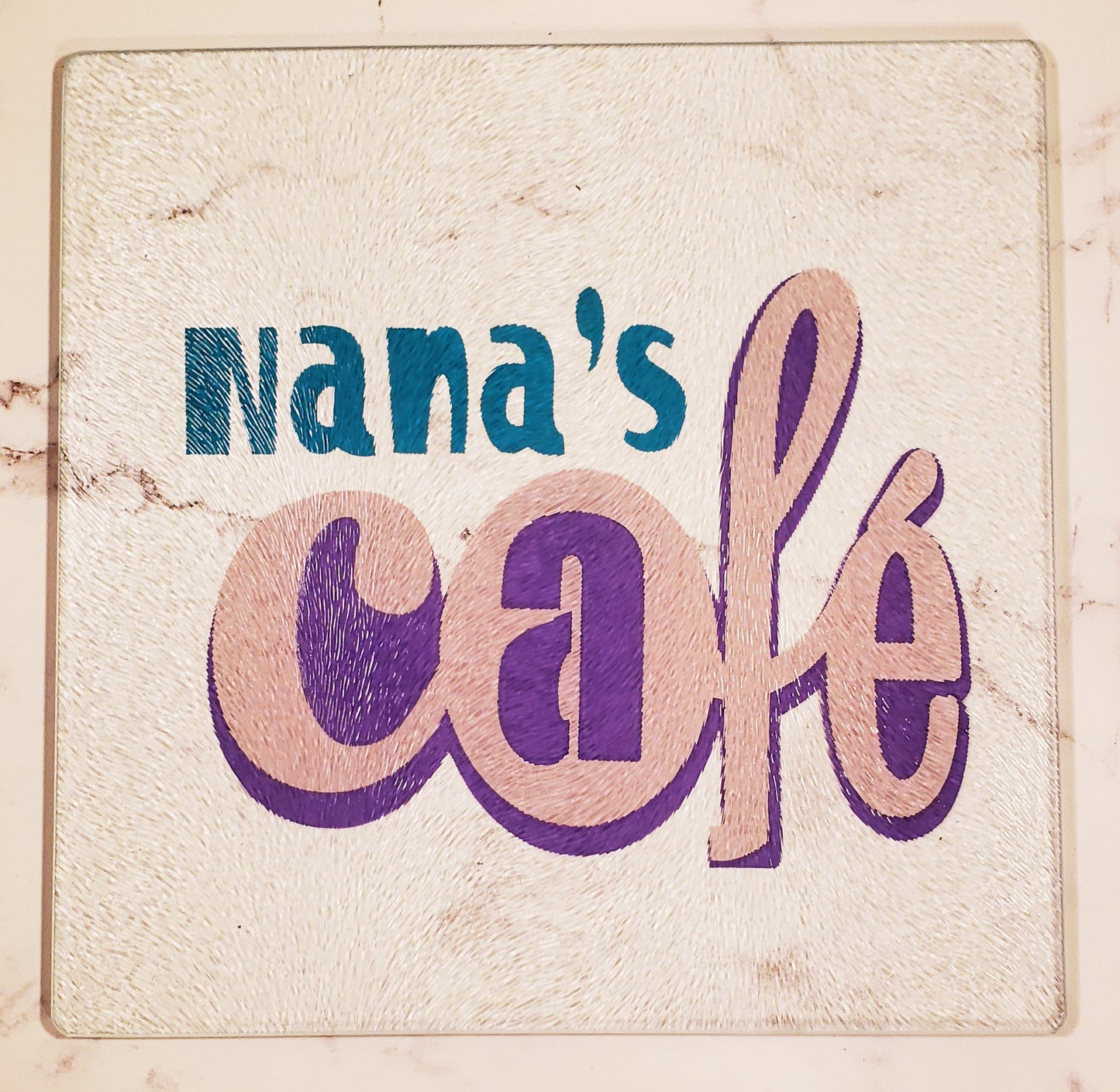 Nana's Café in Turquoise, Pink and Purple Glass Cutting board