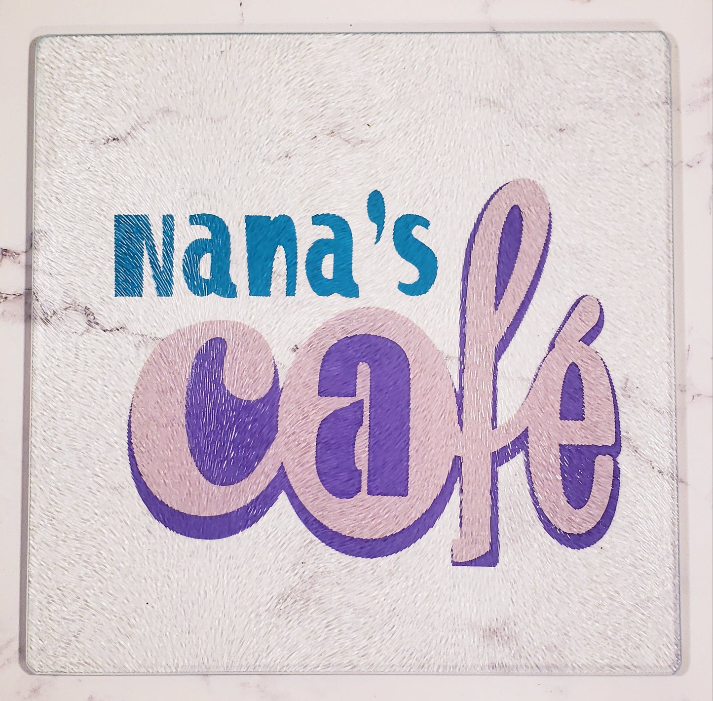 Nana's Café in Turquoise, Pink and Purple Glass Cutting board