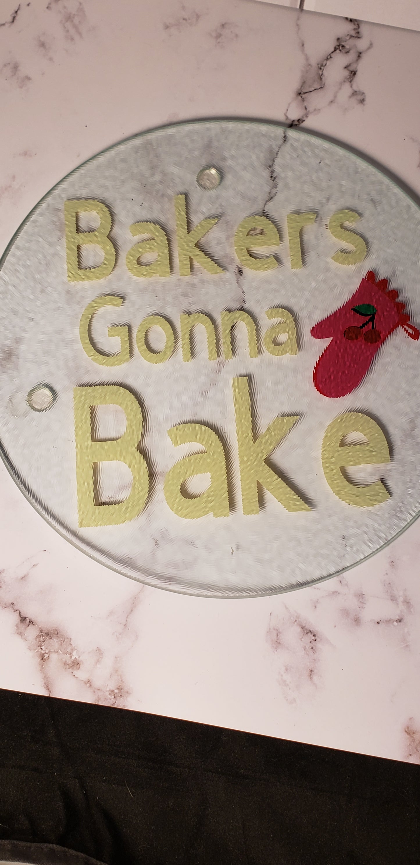 Baker's Gonna Bake round glass cutting board