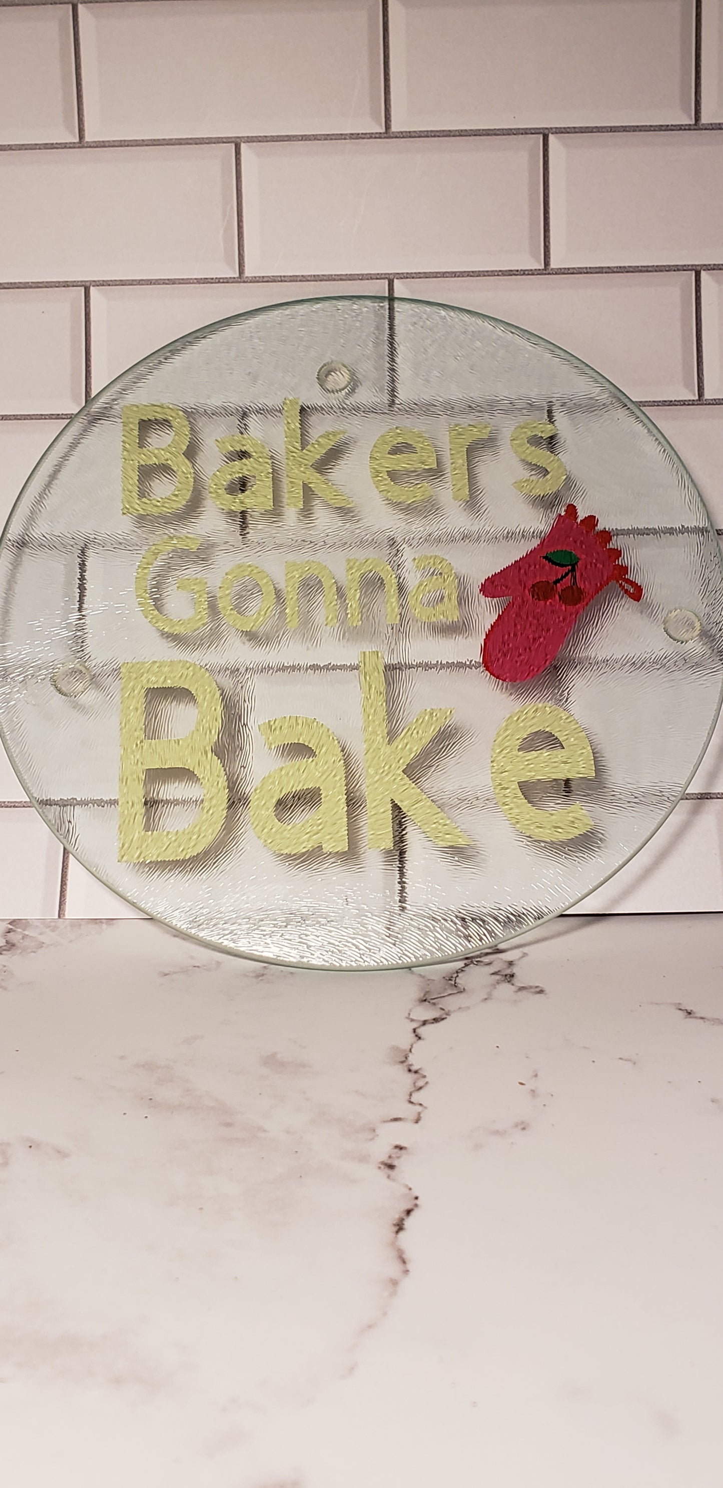 Baker's Gonna Bake round glass cutting board